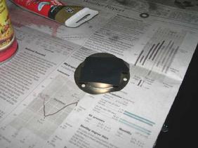 Tape over a hole in the mount, squirt some caulk